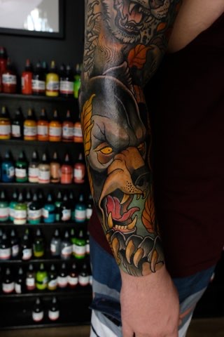 Coloured forearm cover up tattoo