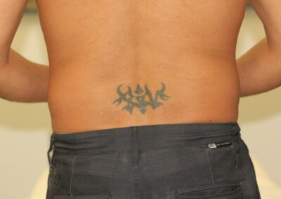Dark and Deep Black Tattoo on Lower Back