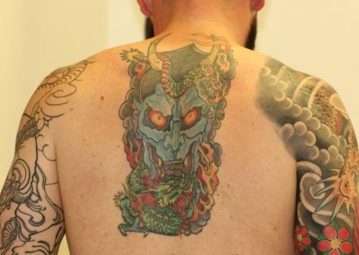 Coloured Back Tattoo Fade Before Laser