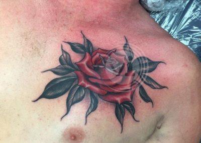 New coloured rose chest tattoo after laser fade of old tattoo